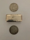 One 5.5 Ounce Silver Bar , One Liberty Half Dollar And One Franklin Half Dollar
