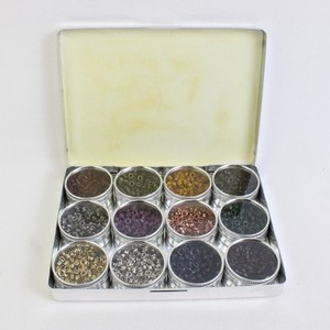 Silver Tin of Assorted Colors Eyelet Grommets, 12 small containers