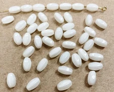 50 VINTAGE CZECHOSLOVAKIAN GLASS WHITE OPAL 9x5mm. QUADRILATERAL OVAL BEADS G337