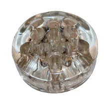 vintage round clear glass 11-hole flower frog with feet floral arrangements