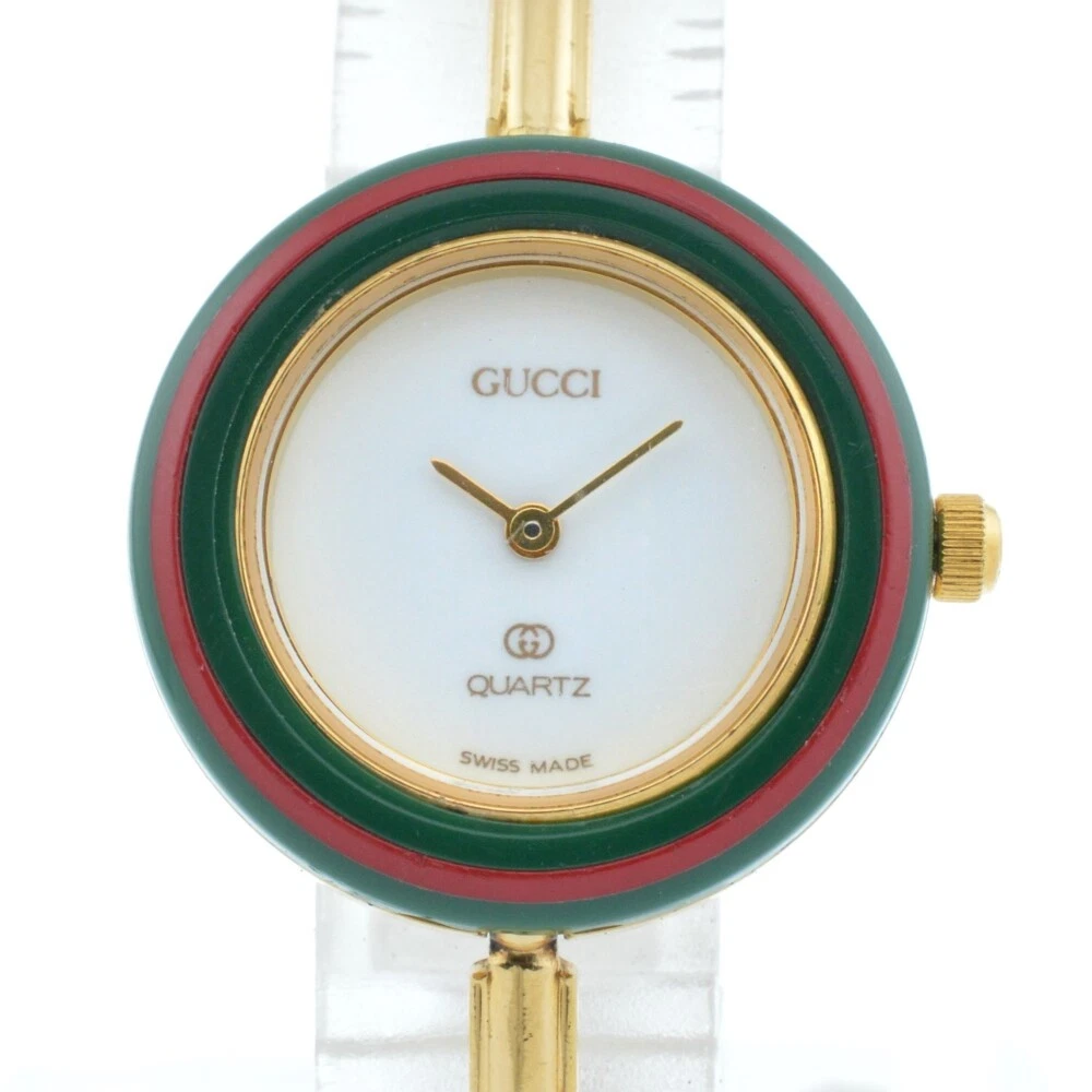 Montre à quartz pour femme GUCCI lunette à changement 1100 L cadran blanc plaqué or G#136727