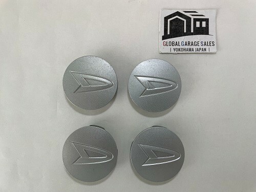 Juego de 4 tapas centrales genuinas JDM Daihatsu plata 52 mm para rueda de aluminio  - Imagen 1 de 3