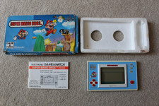 Thumbnail of ebay&reg; auction 167660914354 | VERPACKTES NINTENDO GAME & WATCH SUPER MARIO BROS YM-105 1988 GUTER ZUSTAND