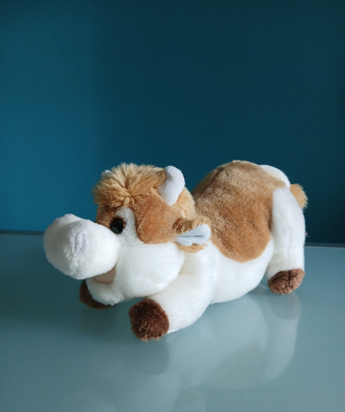 "TRUDI" peluche Mucca "BETTY", colore bianco e marrone, h. 16 cm, lung. 35 cm.