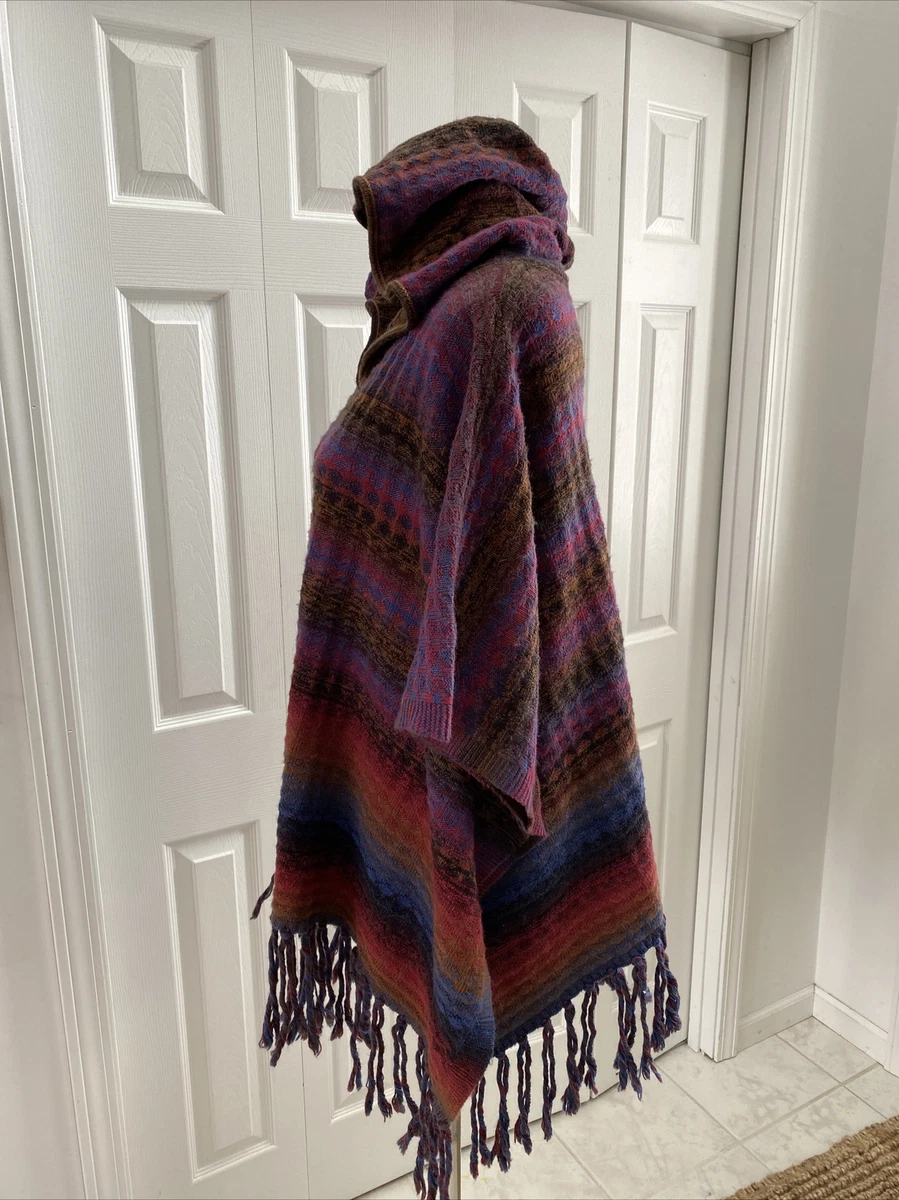 Poncho sweater with store side buttons