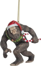 Bigfoot Wearing Santa Hat Walking with Candy Cane Sasquatch Christmas Ornament
