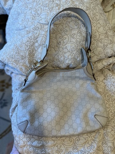 Vintage Gucci white hobo handbag with repeating interlocking G logo