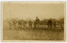 Circa 1908 football team RPPC real photo post card practice action