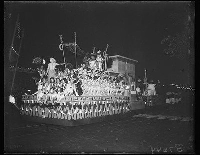 Photo:1920s Parade Float Costumed Performers Night Street Scene