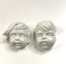 zwei Wandfiguren Kinderköpfe von Metzler & Ortloff ca. 6 cm Länge