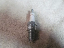 NEW VINTAGE CHAMPION SPARK PLUG, PART NUMBER N-64Y.