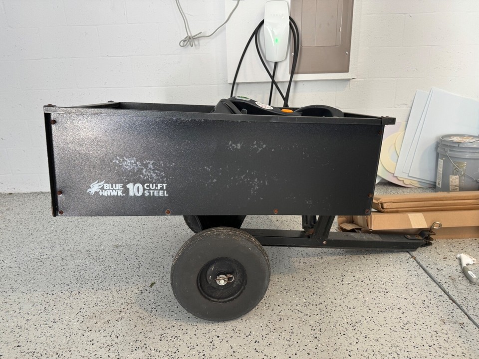 Ryobi RM480e Electric Riding Lawn Mower comes with 10 cu. Feet Steel