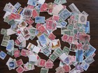 Canada 100s of used stamps mass 25 gm   off paper
