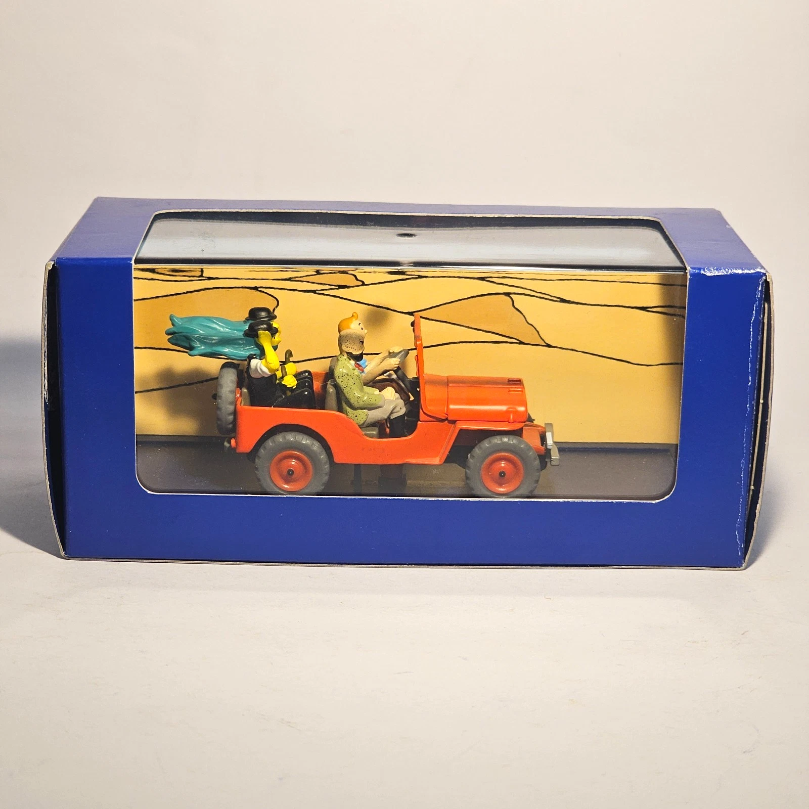 Voiture Miniature Tintin La jeep rouge de la couverture de Au pays de l'Or Noir