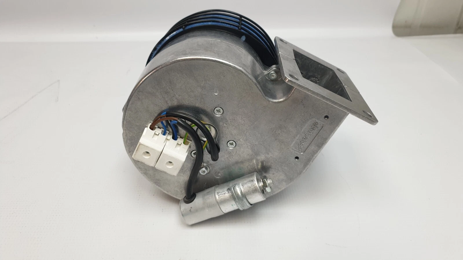 Motor side of the blower with two white terminal blocks and run capacitor