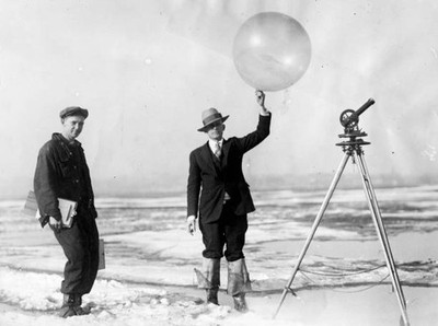 Two men hold a balloon that helps determine direction velocit- Boston Old Photo