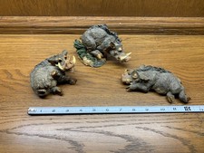 3 whimsical cute warthog figures made of resin