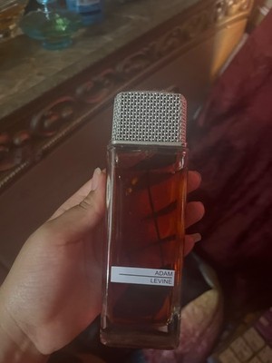 Adam Levine perfume new and medium sized and dark color and shiny top