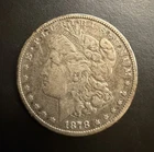 1878-CC Morgan Dollar in VG-F condition with clear Liberty, date and mint mark