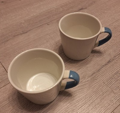 2 Ikea Kaffeetassen creme mit blauen Griffen sehr guter Zustand keine Chips Risse oder Flecken