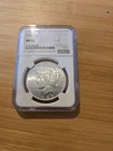 1927-P peace dollar, NGC MS-62 (damage on label on back)