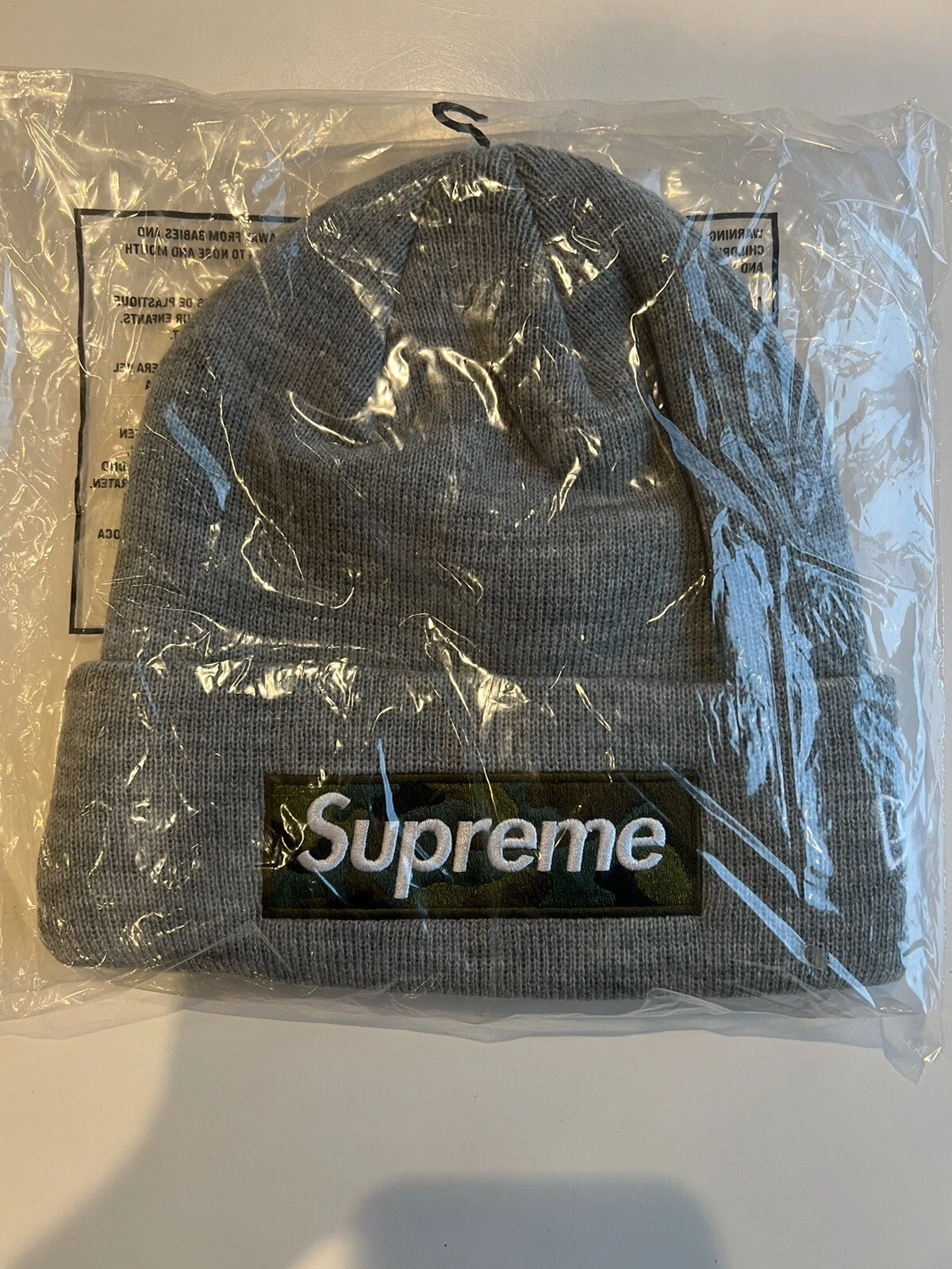 LOGO BOITE SUPREME/NEW ERA BEANIE HEATHER GRIS FW23 SEMAINE 16