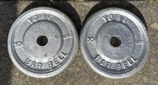 PAIR OF VINTAGE YORK BARBELL CO. 10 POUND STD HOLE CAST IRON WEIGHT PLATES