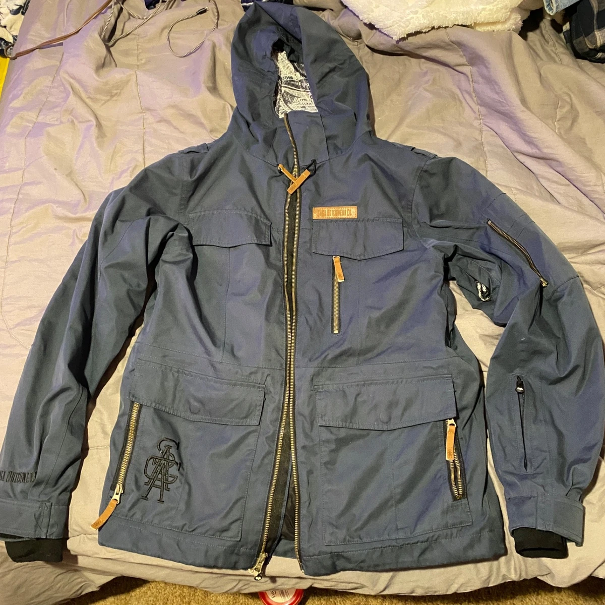 Saga Outerwear Anomie 2L Ski/Snowboard Jacket - Rare Newspaper