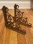 pair of ornate cast iron wall shelf brackets brown rust coloring 7-1/2”