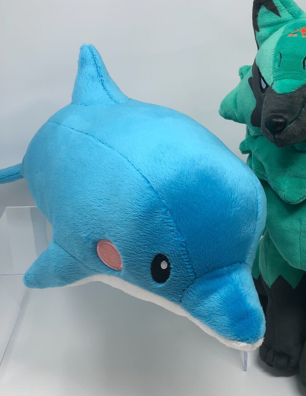 bridget from guilty gear finds a blue shark plush in a