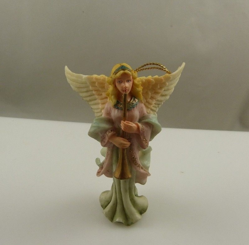  Christmas ornament Angel holding a trumpet plastic or resin  vintage xmas