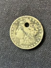 1886-O Morgan Silver Dollar with hole drilled