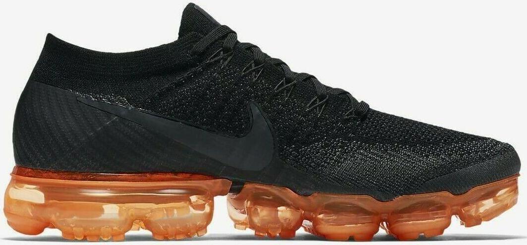 black and orange nike vapormax plus
