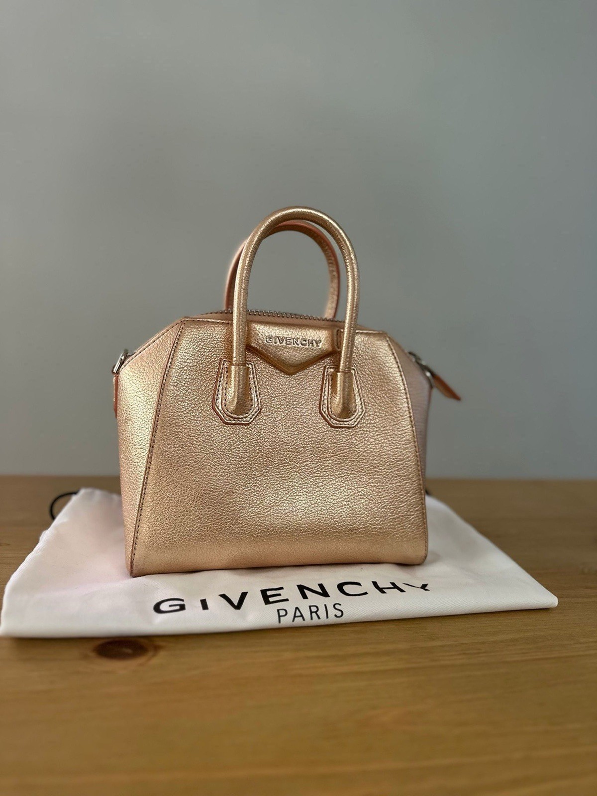 Givenchy Antigona Mini Leather Top Handle Bag in a metallic rose gold colour