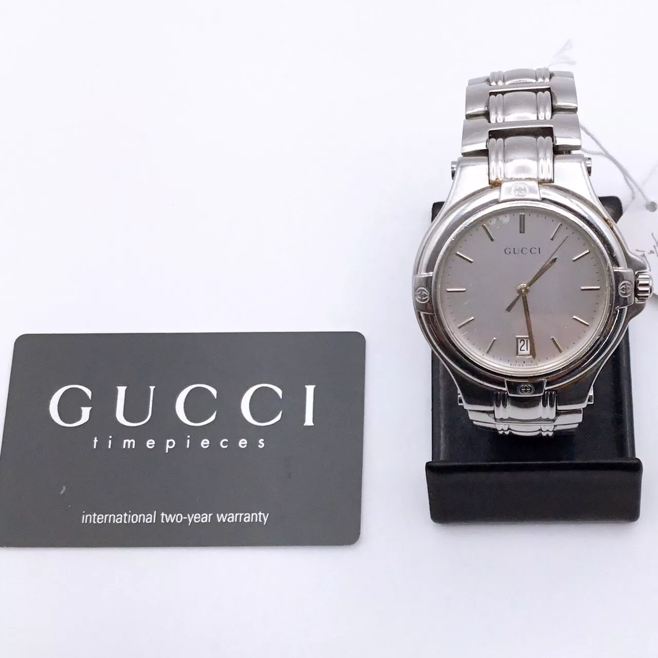 Authentique montre Gucci « Excellent état » signature 9040M métal reflex avec boite carte G