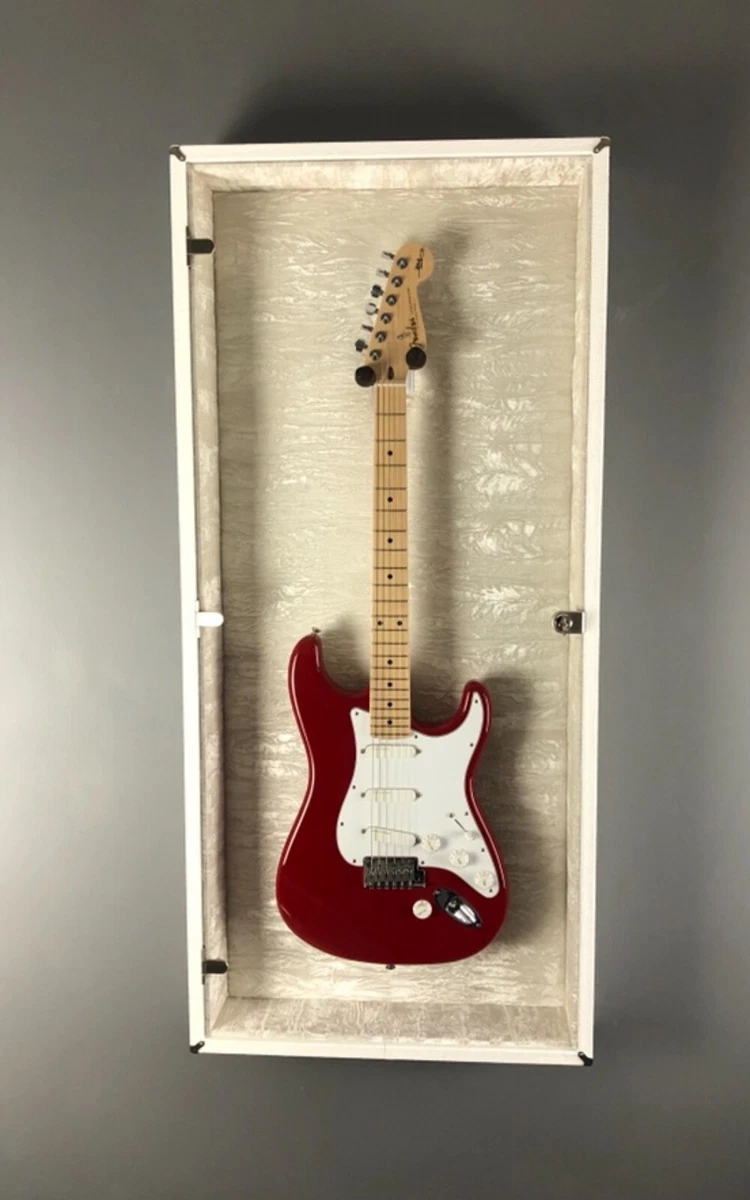 guitar display case with white tolex and string swing guitar hanger