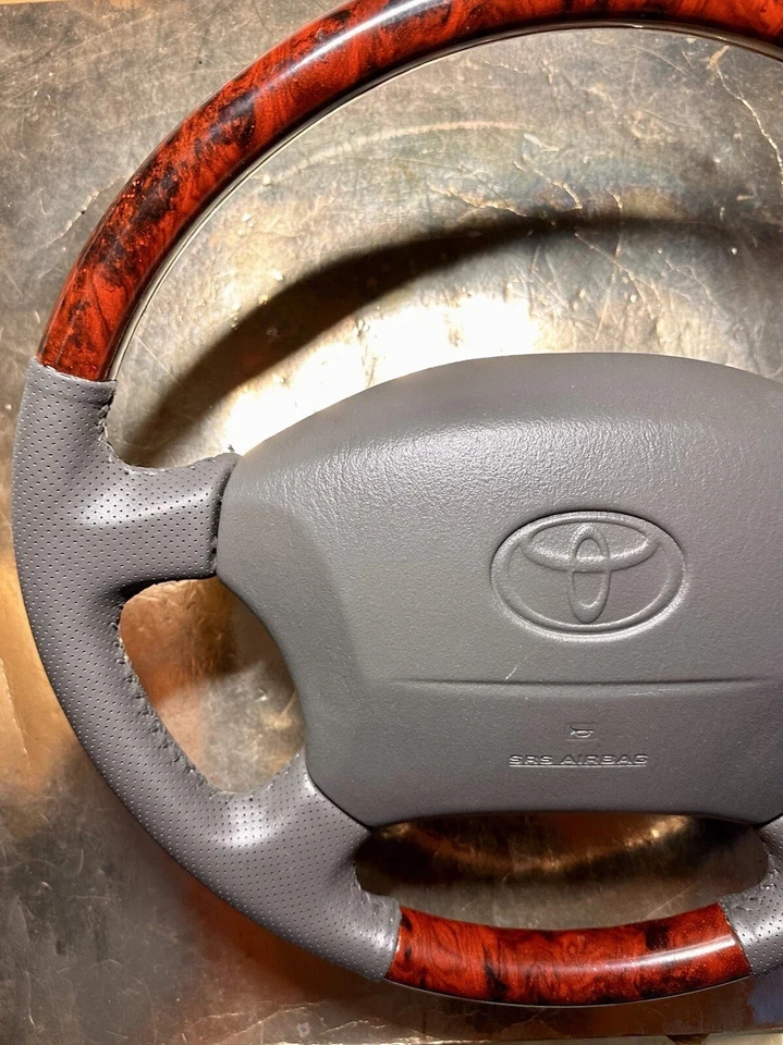 Volante Toyota Land Cruiser Serie 100 Marrón Lexus LX470 Madera Perforada Foto 3 de 4