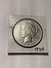 1934 $1 Peace Dollar XF TO AU. Silver. Breaking high grade set. Lovely.