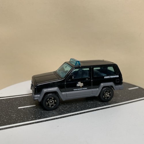 2018 Matchbox Texas Patrol Jeep Cherokee XJ Black State Trooper Police 1:64 NM - Picture 11 of 12