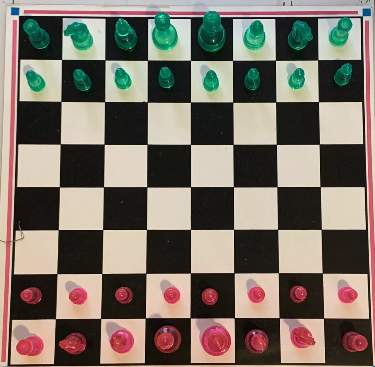 Free Photo  Green and pink pieces for chess with game board