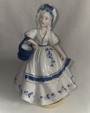 Statuina musicale porcellana Royal Crown Derby blu e bianca con accenti oro