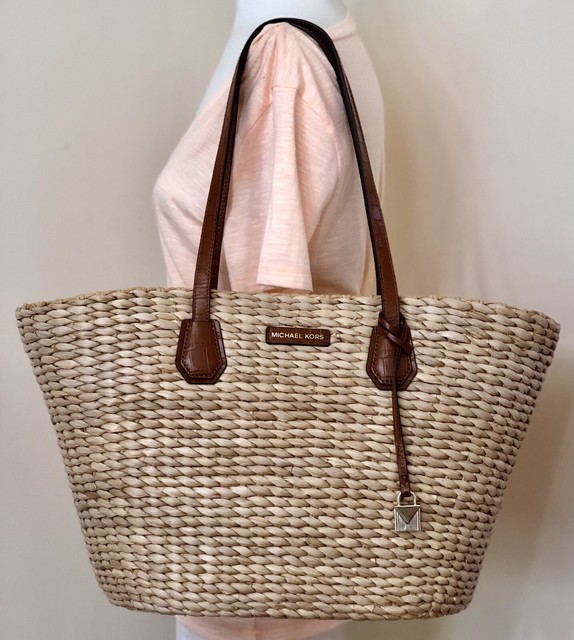 white and brown michael kors purse