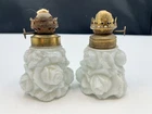 Pair of antique milk glass miniature oil lamps with rose pattern