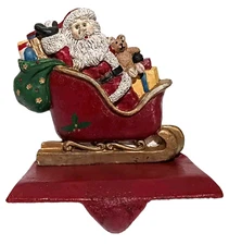 CAST IRON STOCKING HANGER -- SANTA IN A SLEIGH