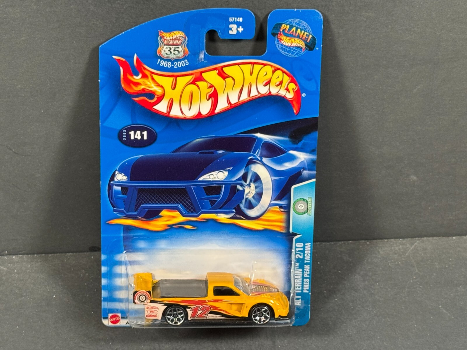 2003 HOT WHEELS  Pikes Peak Tacoma 2/10, Yellow, Alt Terrain,  #141