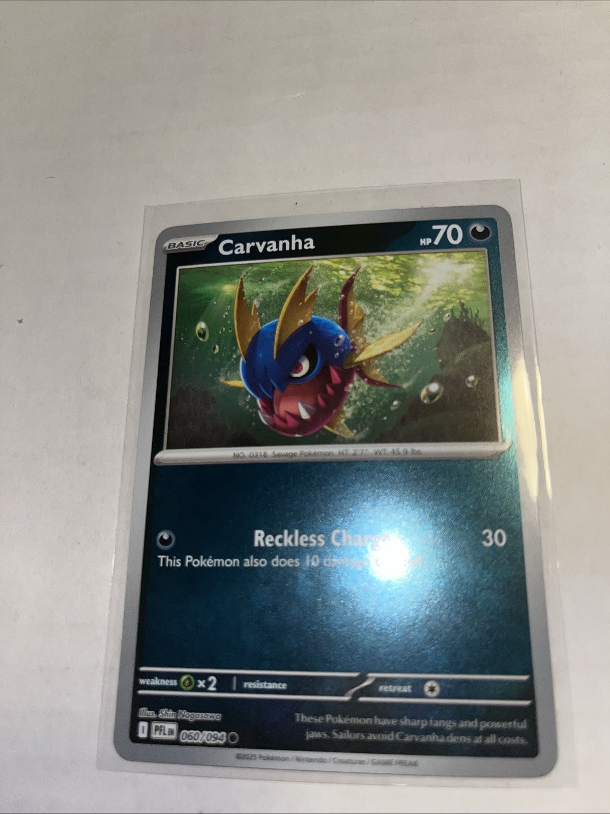 Carvanha 060/094 Me02: Phantasmal Flames Reverse Holo