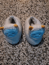 Used fluffy peluche slippers