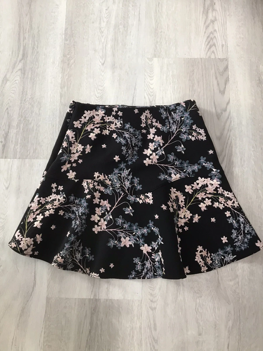 Black flippy hem skirt sale