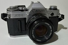 Canon AE-1 Program Black 35mm SLR Film Camera w/ 50mm f/1.8 FD Lens - WORKING