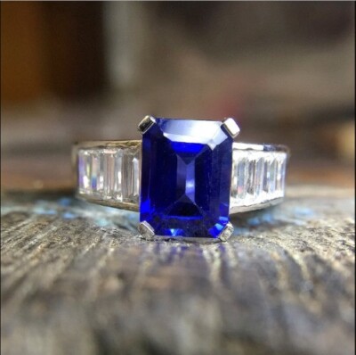 2Ct Emerald Cut Simulated Blue Sapphire Engagement Ring In 14K White Gold Plated